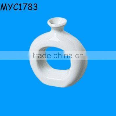 White ceramic napkin ring vase