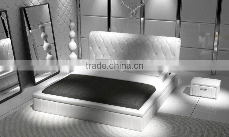 Luxury white leather hotel bed with high headboard