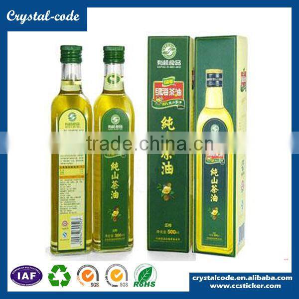 Adhesive waterproof labels for essential glass olive oil bottles