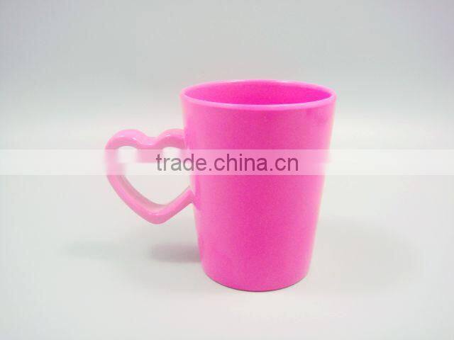 Pink solid color water cup with cute design and handle