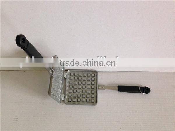 aluminum die cast non stick waffle iron maker on camp fire