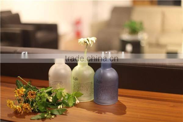 Lovely small round colored glass flower vase for living room