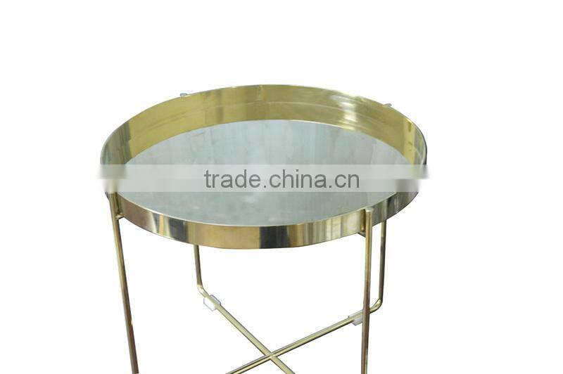Golden stainless steel round coffee table