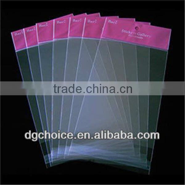 Plastic header bag with hole and lip on the bottom