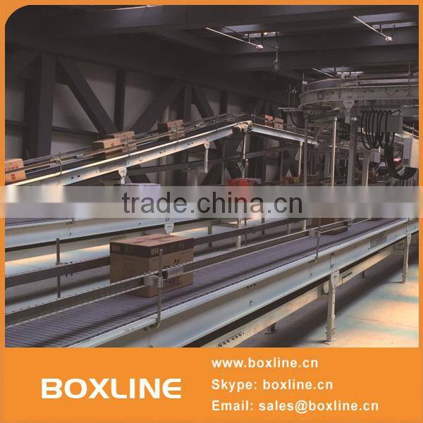 Flexible mesh conveyor for heavy cartons