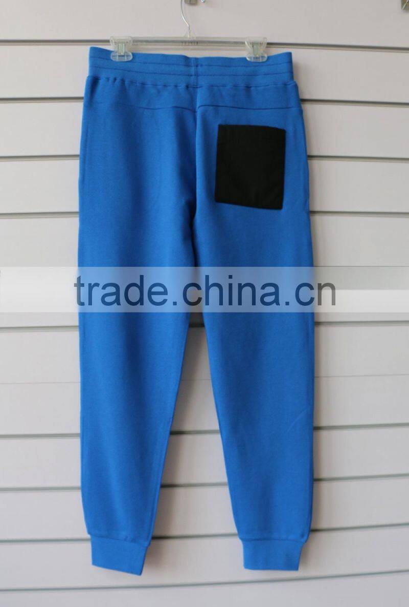 100% cotton men jogging pants with side waterproof pockets and logo print