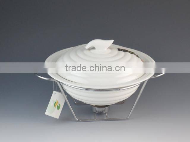 white porcelain casserole with iron rack