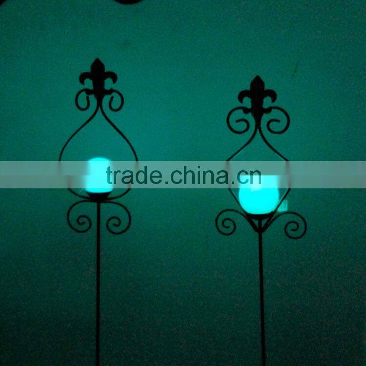 decorating garden edging with metal glow in dark bird stake