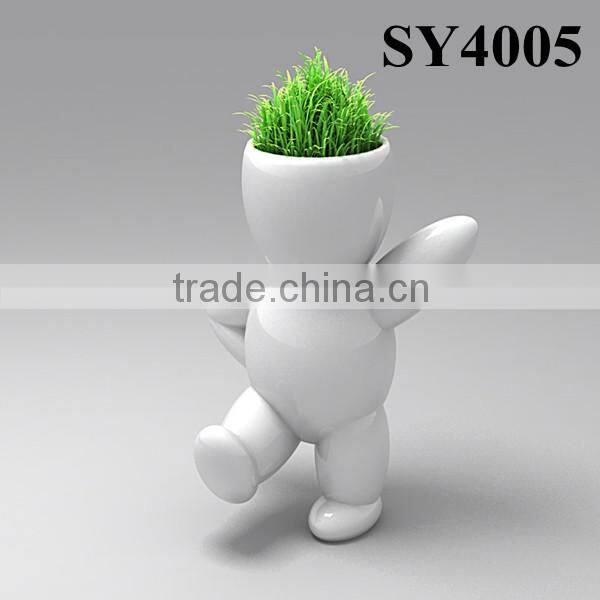 Energy little white man growing grass doll