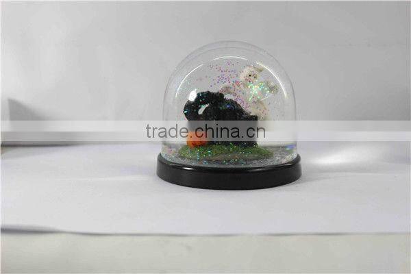 Plastic pumpkin halloween snow globe