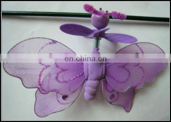 Green butterfly with small pinwheel garden stick decoration