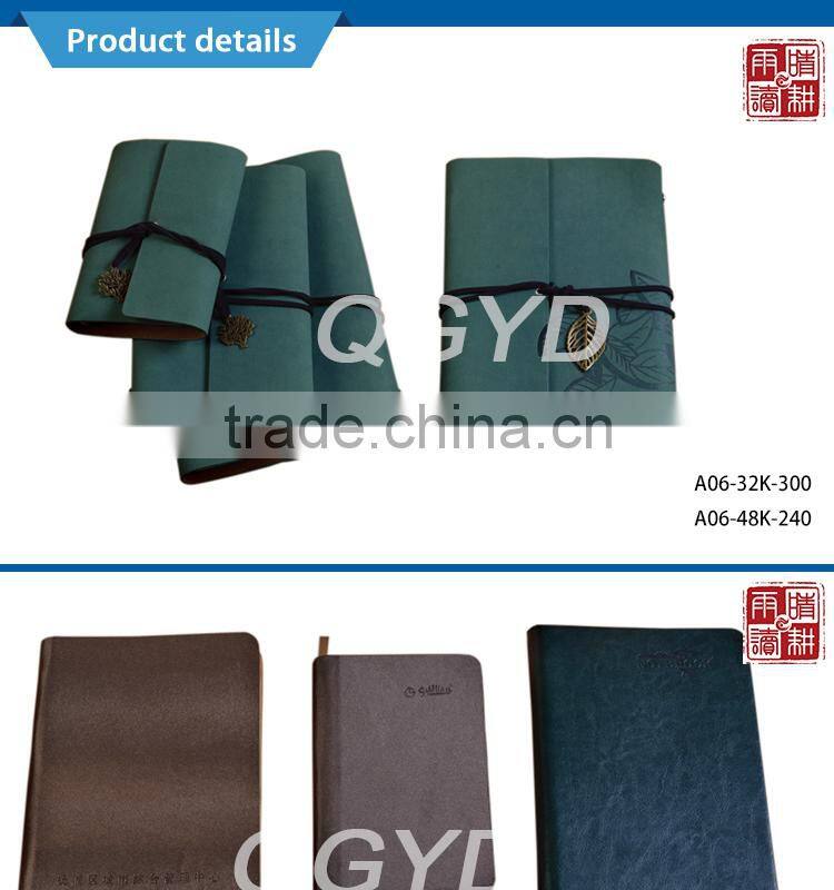 brown color notebook with metal nameplate elastic bind