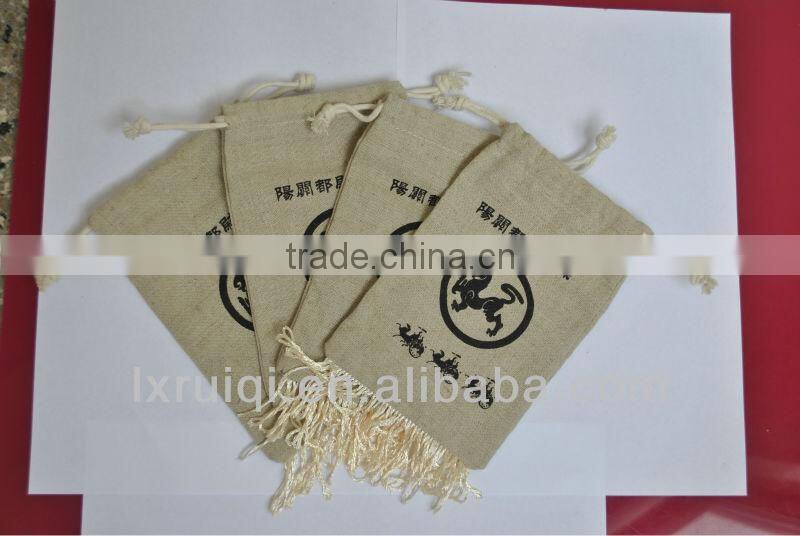 yiwu market cheap jute bag ,drawstring jute packing bags with tassel,promotion pouch