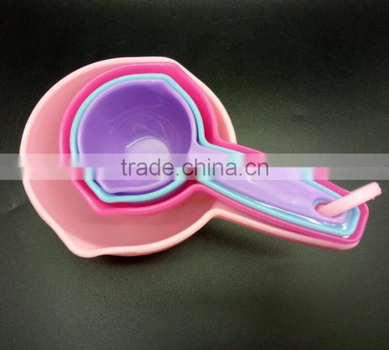 colorful set of 4 plastic measuring cups and spoons