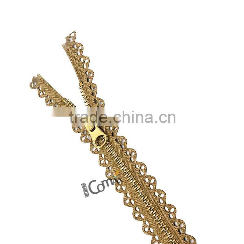 One close Euro style shiny gold metal zip for bag