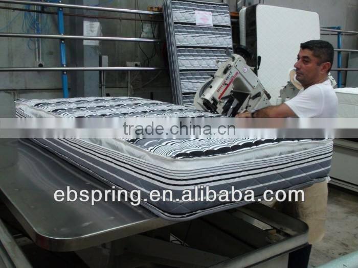 Mattress making machine tape edge machine with adjustable table
