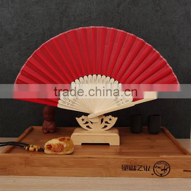 Factory direct bamboo hand fan wedding gift cloth folding hand fan in plain color