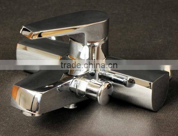 Exposed wall mounted bath and shower mixer tap with divertor