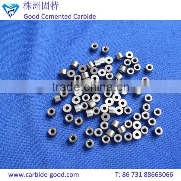 Discharge valve seat made from tungsten carbide