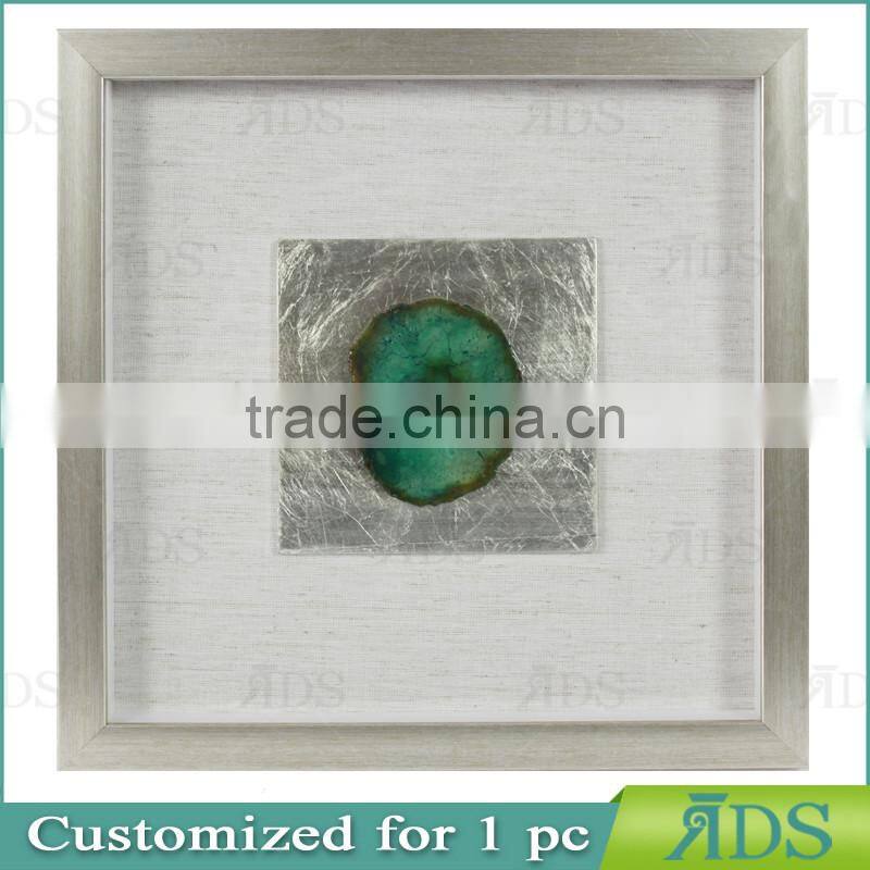 Box photo frames with mottled silver background encasing natural agate under glass