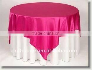 Satin table overlay and round hotel table cover