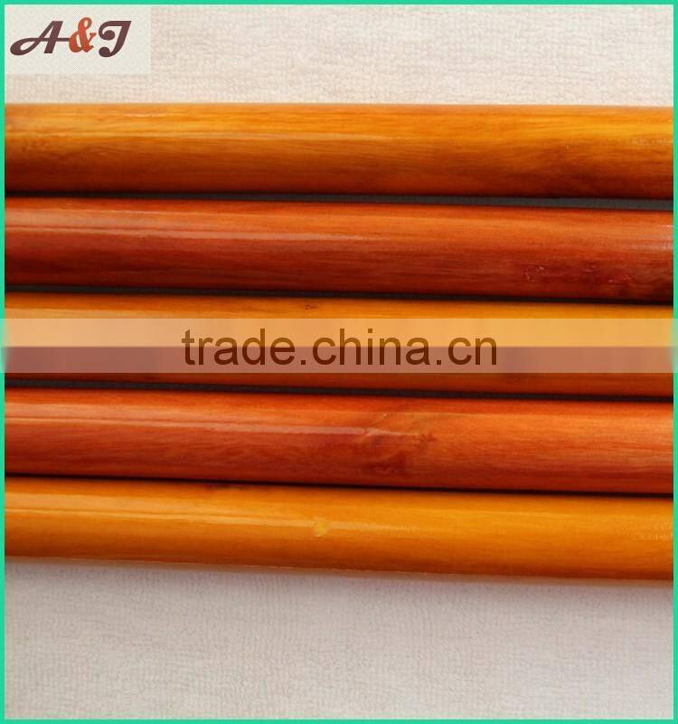 varnished wooden broom handle with long hanger