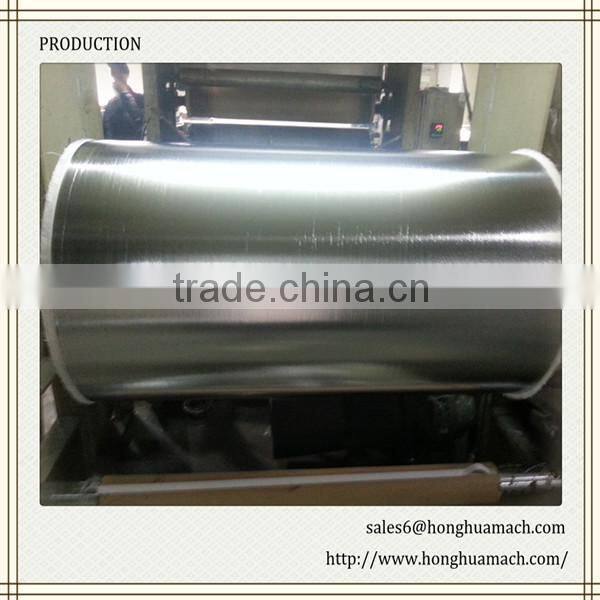 Heat laminating machine for aluminum foil and glassfibre cloth