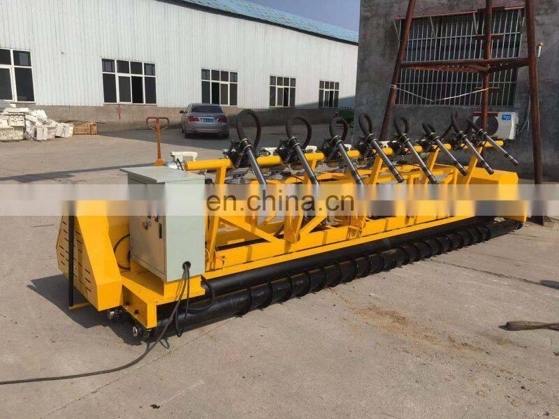 concrete road paver machine showing the first auger blade roller laying machine