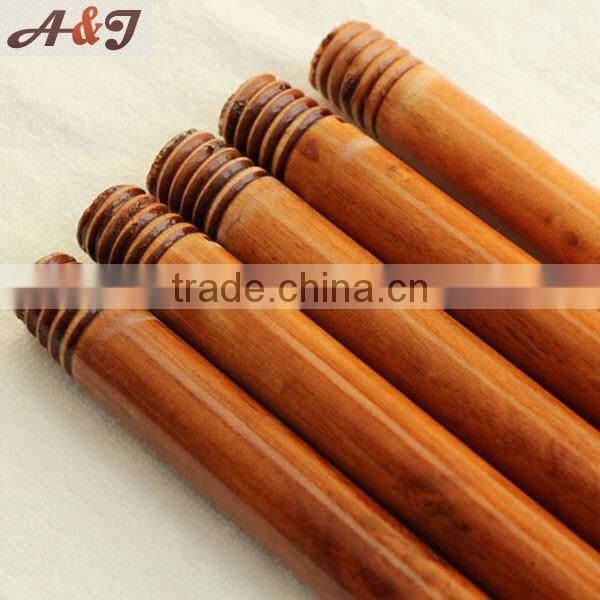 Two times painted wooden screw stick for broom rake