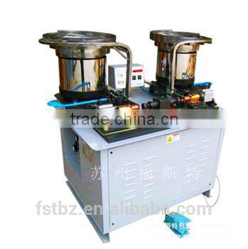 Automatic earlug spot welder for chemcial cans