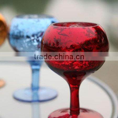 green colored goblet glass candle holder