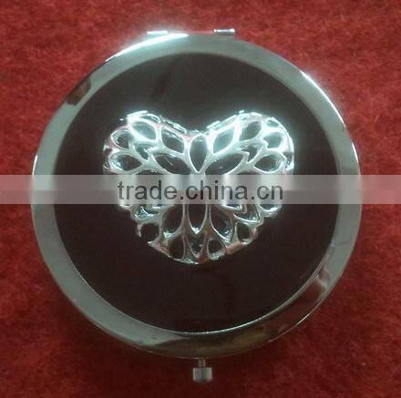 decorative black compact mirror with metal heart decor