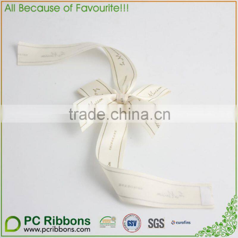 Gift packaging with blue ribbons and bow