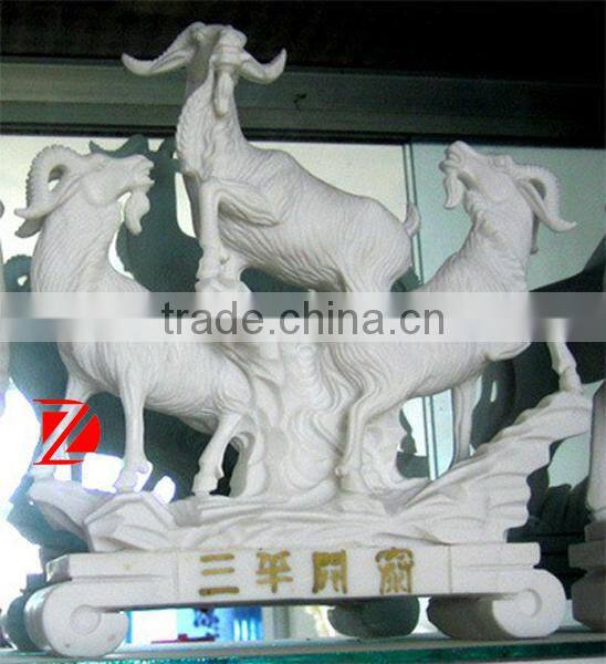 three white stone goat sculpture