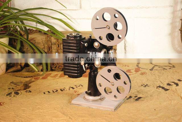 Antique metal movie camera model with paint