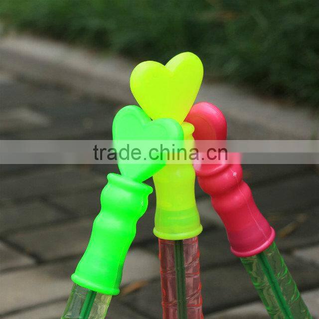 Happy wedding party soap bubble water in tube with heart wand