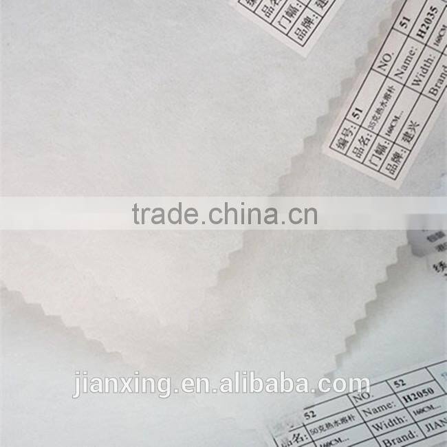 Hot and cold water soluble adhesive interlining for garment embroidery