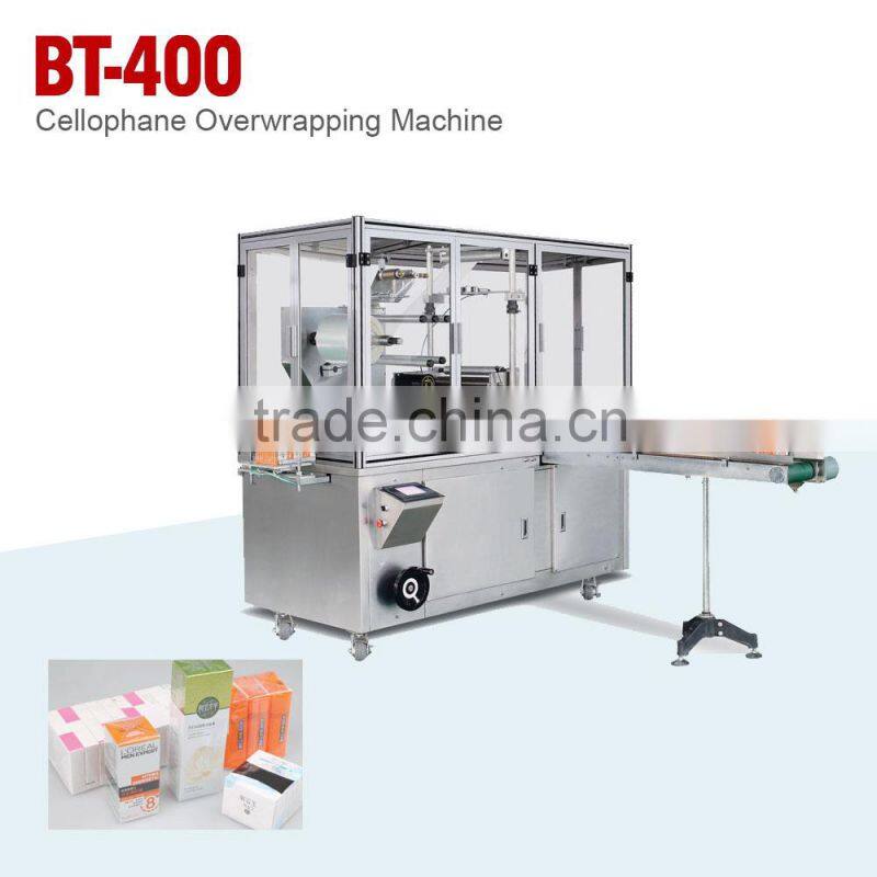 CELLOPHANE OVERWRAPPING MACHINE