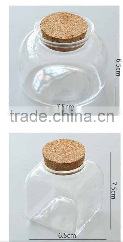 round and square glass bottle with wooden lid