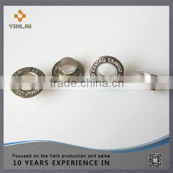 Decorative metal shoe eyelet