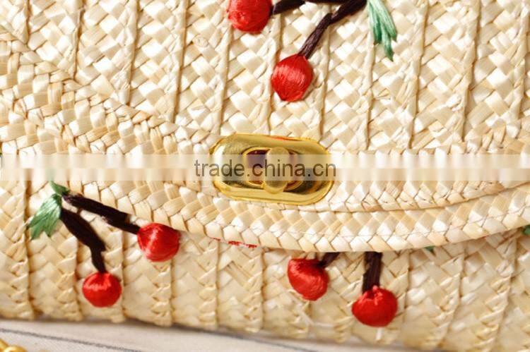 straw clutch bag with cherry pattern, gold chain cross body