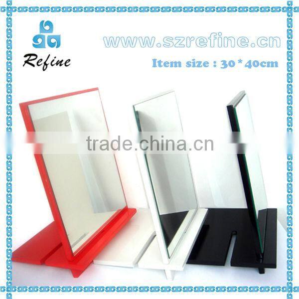 unframed small standing table mirror
