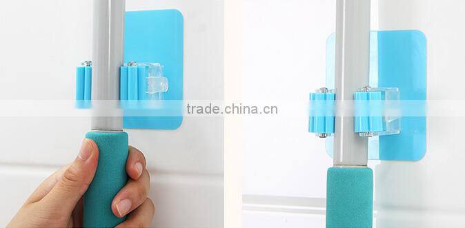 Wholesale Stock Magic Wall Suction Plastic Mop Handle Storage Holder