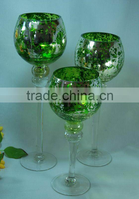green colored goblet glass candle holder