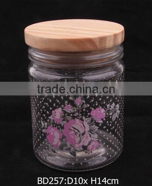glass jar with decal and wooden lid