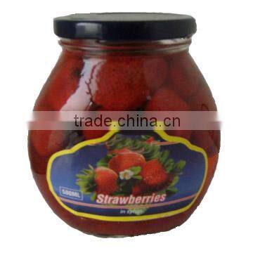 canned Strawberry fruits in light syrup in glass jar