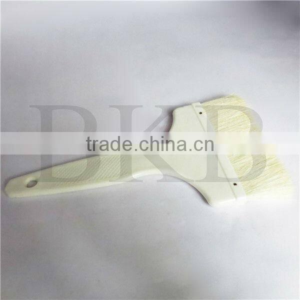 wool paint brush with plastic handle