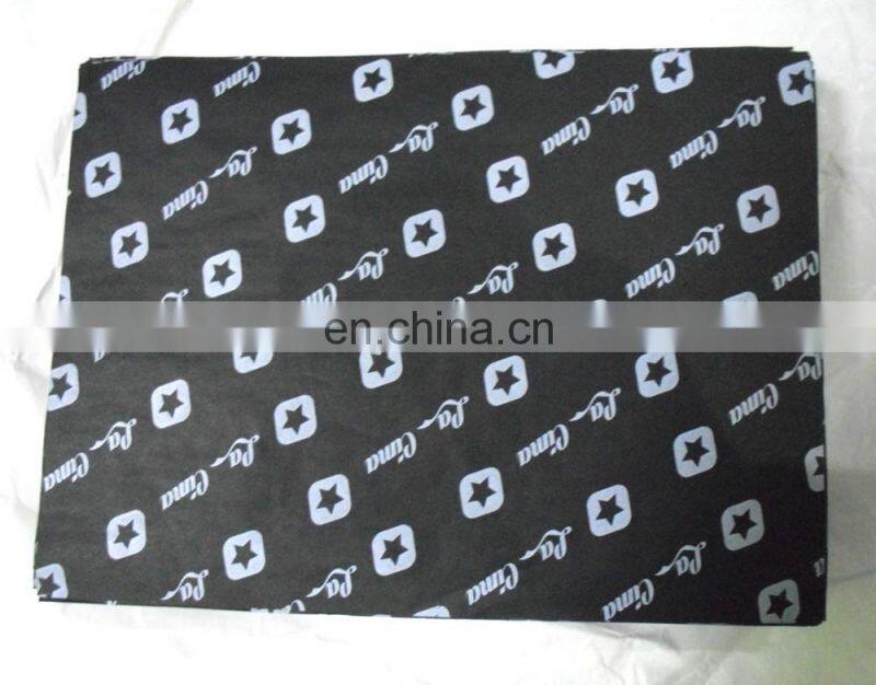 White tissue paper with red logo