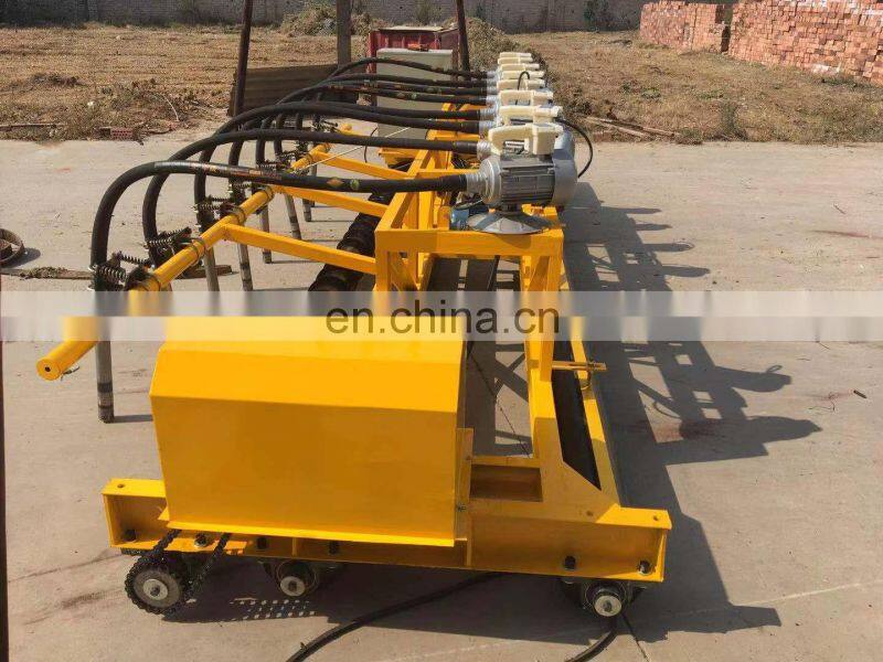 concrete road paver machine showing the first auger blade roller laying machine