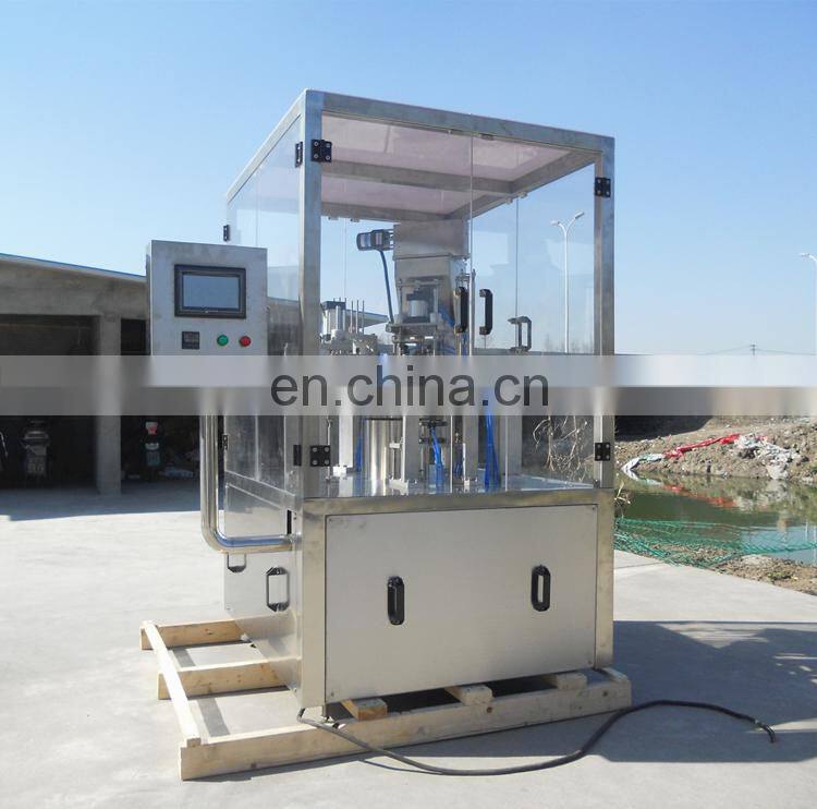 Rotary plastic cup filler and sealer machine